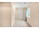 A carpeted hallway with double door closet, small window, and light walls creates a bright and airy space at 5861 Mt Shadows Blvd, Firestone, CO 80504