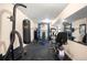 This is a home gym complete with punching bag, free weights, bench, exercise bike, weight rack and mirror at 5861 Mt Shadows Blvd, Firestone, CO 80504