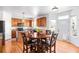 Bright kitchen boasts wood cabinets, granite countertops, and a breakfast nook with backyard views at 5861 Mt Shadows Blvd, Firestone, CO 80504
