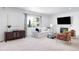 Inviting living room with a fireplace, comfortable seating, and stylish decor at 5861 Mt Shadows Blvd, Firestone, CO 80504