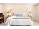 Cozy main bedroom with neutral tones, bedside lamps, and comfortable bedding at 5861 Mt Shadows Blvd, Firestone, CO 80504