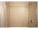 Elegant tiled shower with shower head, temperature controls, and shower curtain at 5861 Mt Shadows Blvd, Firestone, CO 80504