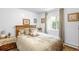 Cozy bedroom featuring a comfortable bed with lots of pillows and bright natural lighting at 9045 W Ithaca Pl, Denver, CO 80235