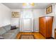 Bedroom with a window allowing natural light to enter, accompanied by a soft sofa at 9045 W Ithaca Pl, Denver, CO 80235