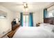 Bedroom with a ceiling fan and access to the balcony at 9045 W Ithaca Pl, Denver, CO 80235