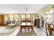 Bright dining room with natural light, complemented by a wooden table and chairs at 9045 W Ithaca Pl, Denver, CO 80235