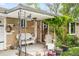 Inviting front porch with seating area, potted plants, and charming decor for a welcoming entrance at 9045 W Ithaca Pl, Denver, CO 80235
