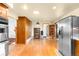 Spacious kitchen featuring stainless steel appliances and ample cabinet space at 9045 W Ithaca Pl, Denver, CO 80235