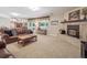 Finished basement with brick fireplace, comfortable seating, and natural light, perfect for relaxation at 3138 E Otero Cir, Centennial, CO 80122