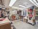 Basement workshop featuring an array of tools, a table saw, and abundant workspace for DIY enthusiasts at 3138 E Otero Cir, Centennial, CO 80122