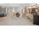 Finished basement featuring a wet bar, carpeted floors, and staircase to upper level at 3138 E Otero Cir, Centennial, CO 80122