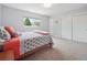 Cozy bedroom featuring closet with sliding doors, a comfy bed, and a bright window at 3138 E Otero Cir, Centennial, CO 80122