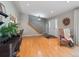 Entryway with hardwood floors, staircase and access to the living area and front door at 3138 E Otero Cir, Centennial, CO 80122