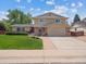 Traditional two-story home featuring a well-maintained front yard and attached garage at 3138 E Otero Cir, Centennial, CO 80122