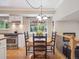 Cozy eat-in kitchen boasts stainless steel appliances and a dining area with decorative lighting at 3138 E Otero Cir, Centennial, CO 80122
