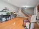 Inviting living area with bar access to kitchen and a staircase to the upper level at 3138 E Otero Cir, Centennial, CO 80122