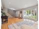 Bright living room with bay window, hardwood floors, and staircase access at 3138 E Otero Cir, Centennial, CO 80122