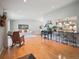 Spacious living room boasts hardwood floors, bar seating and flows into the kitchen at 3138 E Otero Cir, Centennial, CO 80122