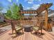Cozy outdoor firepit area with rocking chairs, perfect for relaxing evenings on the wooden deck at 3138 E Otero Cir, Centennial, CO 80122