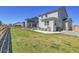 The backyard features a sprawling lawn area, perfect for outdoor enjoyment and relaxation at 45840 Laceleaf Dr, Bennett, CO 80102