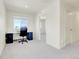 Bright bedroom features a work space with a desk and plush gray carpet at 45840 Laceleaf Dr, Bennett, CO 80102