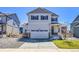 Charming two-story home with a two-car garage, stone accents and well-maintained landscaping at 45840 Laceleaf Dr, Bennett, CO 80102