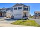 Two-story house featuring a two-car garage and a well-maintained lawn at 45840 Laceleaf Dr, Bennett, CO 80102