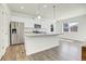 Modern kitchen featuring stainless steel appliances, granite countertops, and a central island at 45840 Laceleaf Dr, Bennett, CO 80102