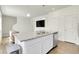 Kitchen island featuring granite countertops, and stainless steel dishwasher at 45840 Laceleaf Dr, Bennett, CO 80102