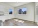 Bright room with large windows offering neighborhood views at 45840 Laceleaf Dr, Bennett, CO 80102