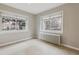 Cozy bedroom with two bright windows offering peaceful neighborhood views at 275 Pontiac St, Denver, CO 80220