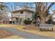 Exterior view of the home, showcasing a well-maintained yard and charming architectural details with fenced yard at 275 Pontiac St, Denver, CO 80220