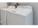 Laundry room showcasing a white washer and dryer set at 275 Pontiac St, Denver, CO 80220