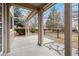 Inviting covered patio with decorative stone accents, ideal for outdoor living and entertaining with views to the yard at 275 Pontiac St, Denver, CO 80220