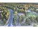 Expansive aerial shot showcasing the property nestled within a lush forest, highlighting privacy and natural beauty at 18330 Archers Dr, Monument, CO 80132