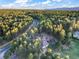 Beautiful aerial view of an estate nestled among mature trees, offering privacy and stunning natural surroundings at 18330 Archers Dr, Monument, CO 80132