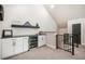Entertainment area featuring a bar, wine fridge, black countertop and metal railing to the lower level at 18330 Archers Dr, Monument, CO 80132