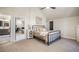 Inviting bedroom with a view of an attached bathroom, vaulted ceiling, and neutral color palette at 18330 Archers Dr, Monument, CO 80132