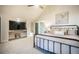 Bedroom features a neutral color palette, built-in tv, vaulted ceilings, and a metal bed frame at 18330 Archers Dr, Monument, CO 80132