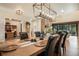 Well-appointed dining room featuring stylish lighting, a large table setting, and a view into the adjacent living space at 18330 Archers Dr, Monument, CO 80132