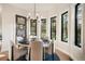 The breakfast nook features wooded views, recessed lighting, and modern finishings at 18330 Archers Dr, Monument, CO 80132