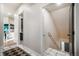 Hallway leads to laundry and open kitchen area with unique tile flooring and view to the basement stairs at 18330 Archers Dr, Monument, CO 80132