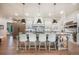 Spacious kitchen island with breakfast bar seating and modern pendant lighting at 18330 Archers Dr, Monument, CO 80132