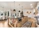 Beautiful kitchen boasts a large island with storage and pendant lighting above it at 18330 Archers Dr, Monument, CO 80132