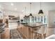 Spacious kitchen with a large island, stainless steel appliances, and a breakfast bar, ideal for culinary enthusiasts at 18330 Archers Dr, Monument, CO 80132