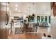 Beautifully designed kitchen with a center island, stainless steel appliances, and an adjacent dining area with natural lighting at 18330 Archers Dr, Monument, CO 80132