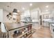 Gourmet kitchen features a large island, custom cabinets, stainless steel appliances, and modern lighting at 18330 Archers Dr, Monument, CO 80132
