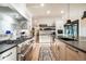 Modern kitchen featuring stainless steel appliances, a subway tile backsplash, and a functional layout for cooking and entertaining at 18330 Archers Dr, Monument, CO 80132