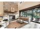 Vaulted ceilings and a beautiful stone fireplace create a grand living room space at 18330 Archers Dr, Monument, CO 80132