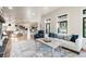 Spacious living room showcasing an open layout, natural light, and stone fireplace at 18330 Archers Dr, Monument, CO 80132